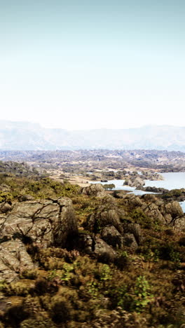 mountainous landscape with lake and rocks