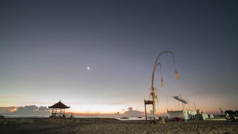 sunrise at a balinese beach temple with decorations