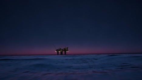 offshore oil rig at night