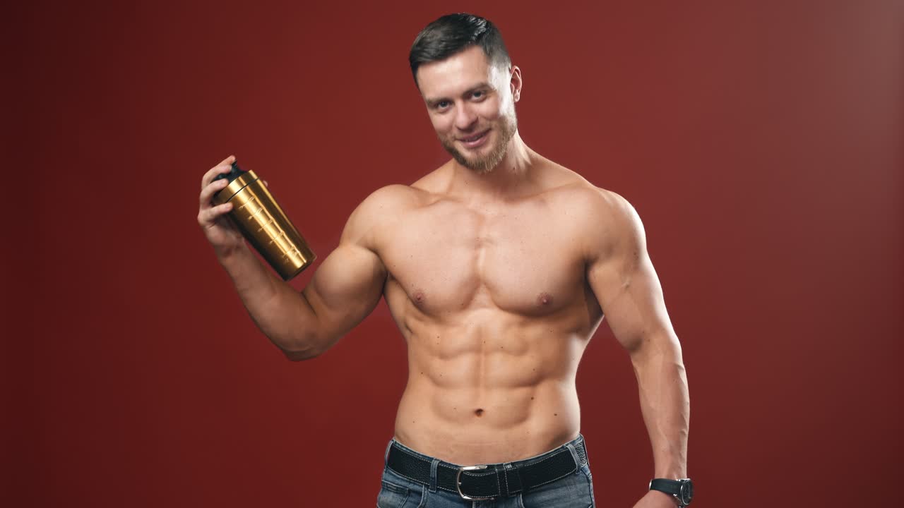 Handsome muscular young man. Muscular model sports young man on background