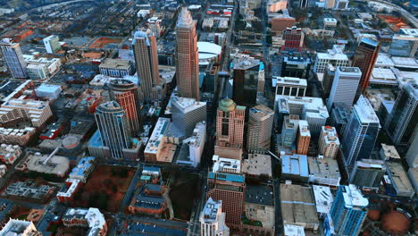 view on modern downtown of charlotte, north carolina at daytime. drone rising above the cityscape opening the view on the vast scenery