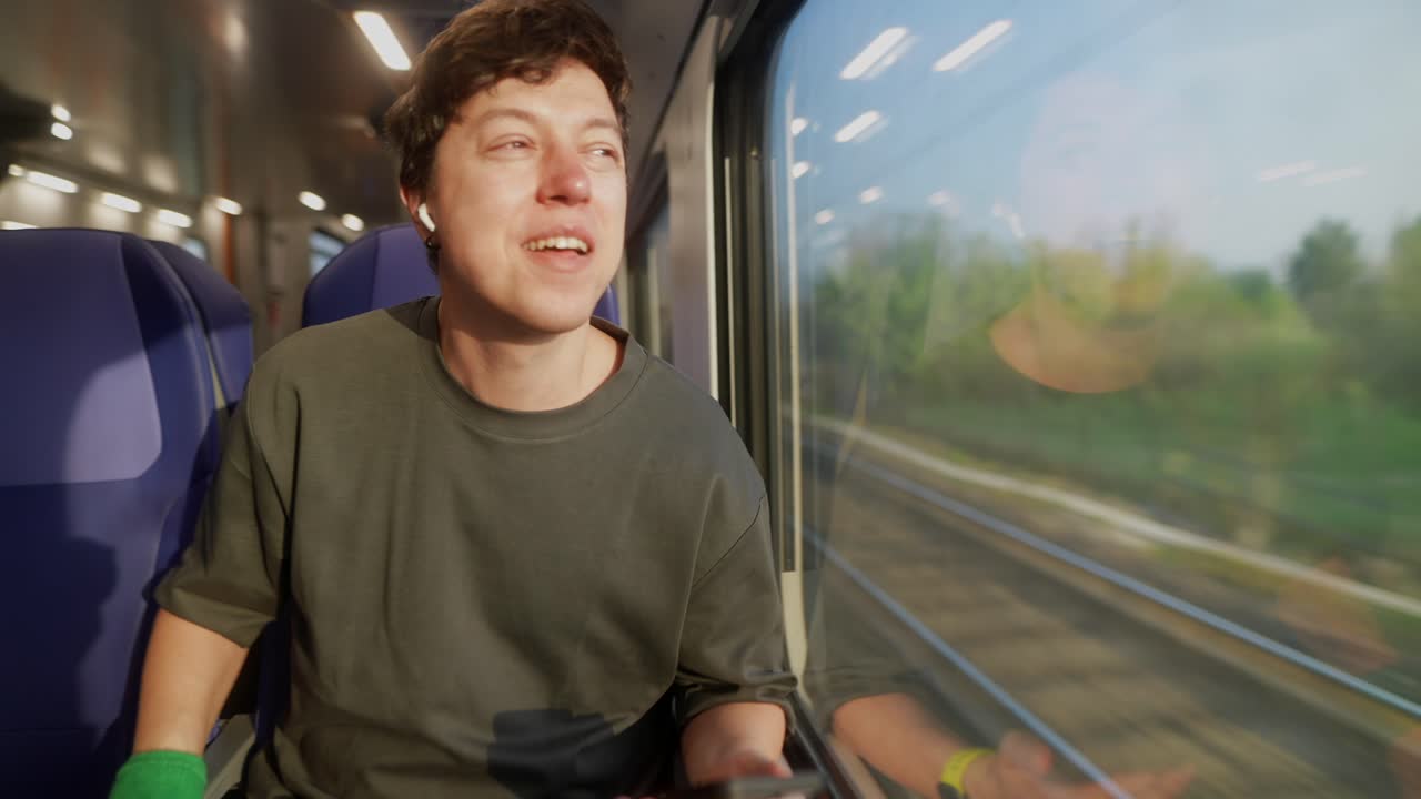 Man listening to music on a train
