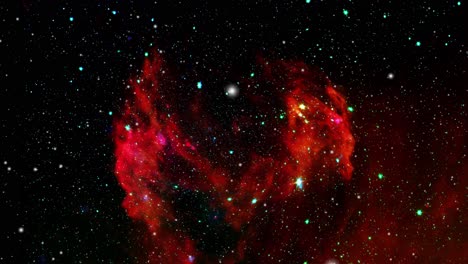 red nebula clouds studded with stars in the cosmos, space