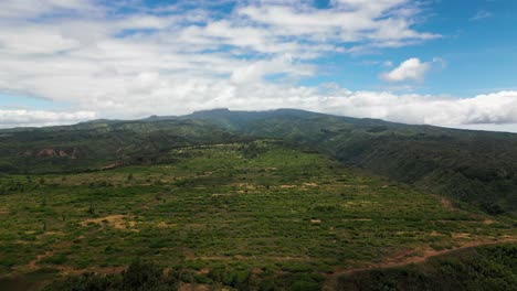 vast green mountain landscape under a cloudy sky