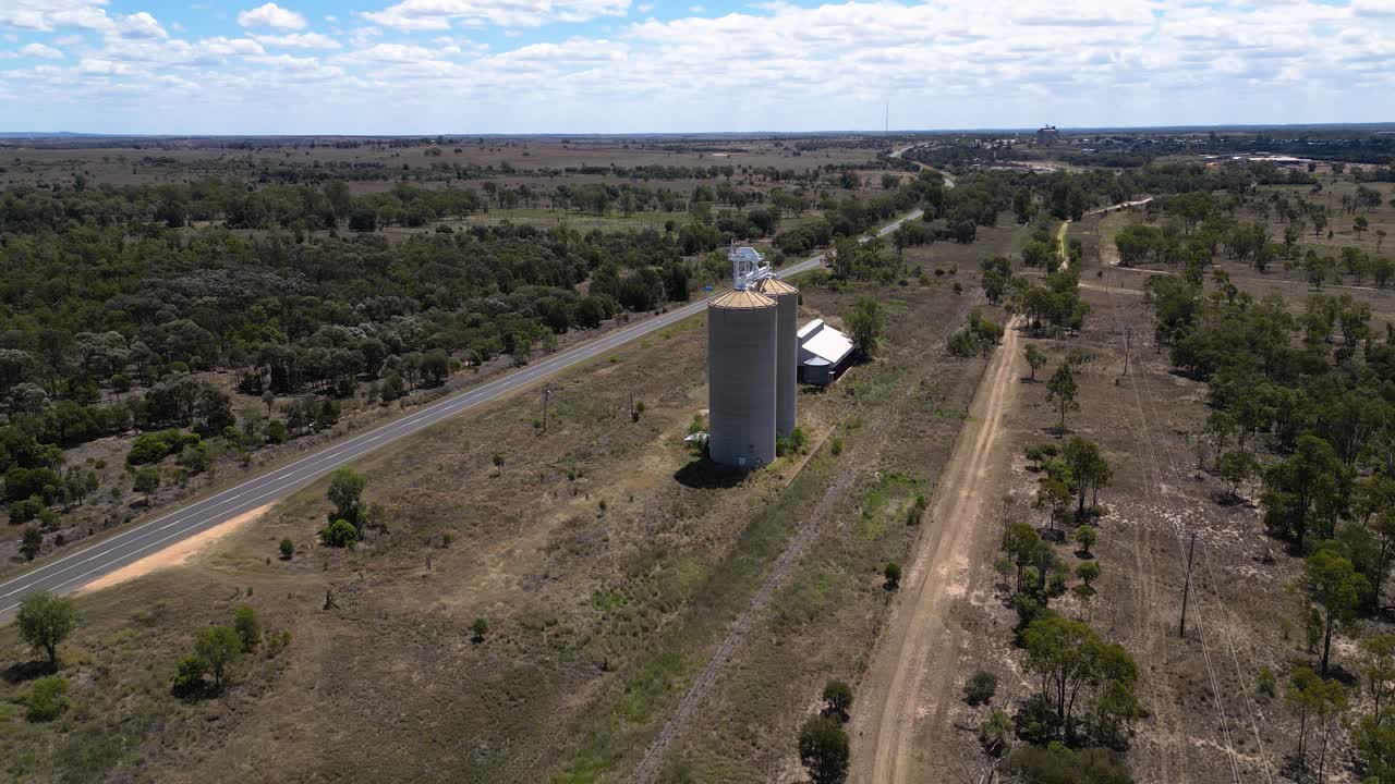 Right to left aerial views over grain silos just outside Wandoan, Queensland.
