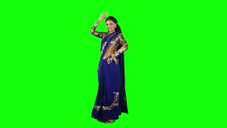 indian woman dancing with saree clothes dancing