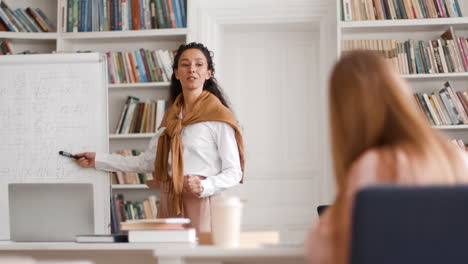teacher presenting math in a library