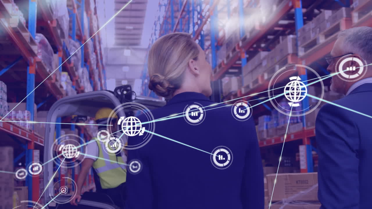 Network of digital icons against caucasian male and female supervisors discussing at warehouse