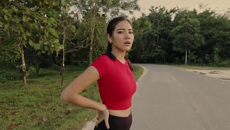 Woman in Red Sports Outfit Outdoors