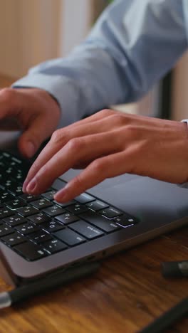 person typing on a laptop