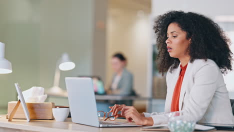 stressed software analyst typing on laptop