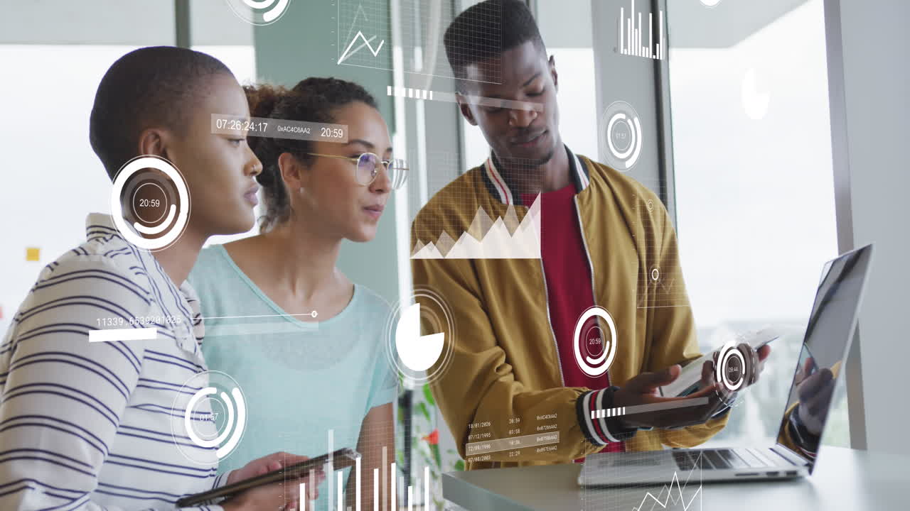 Animation of statistical data processing over diverse colleagues discussing over a laptop at office