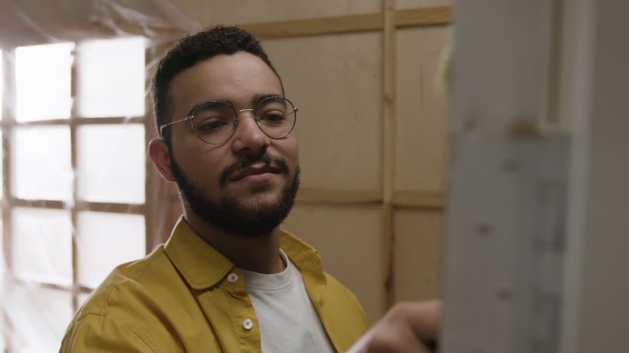 Man painting in art studio