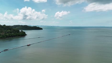 drone shot of a beach in phuket, thailand, fotohotel