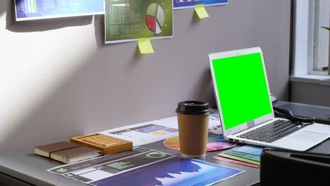 graph chart and laptop on desk in office 4k