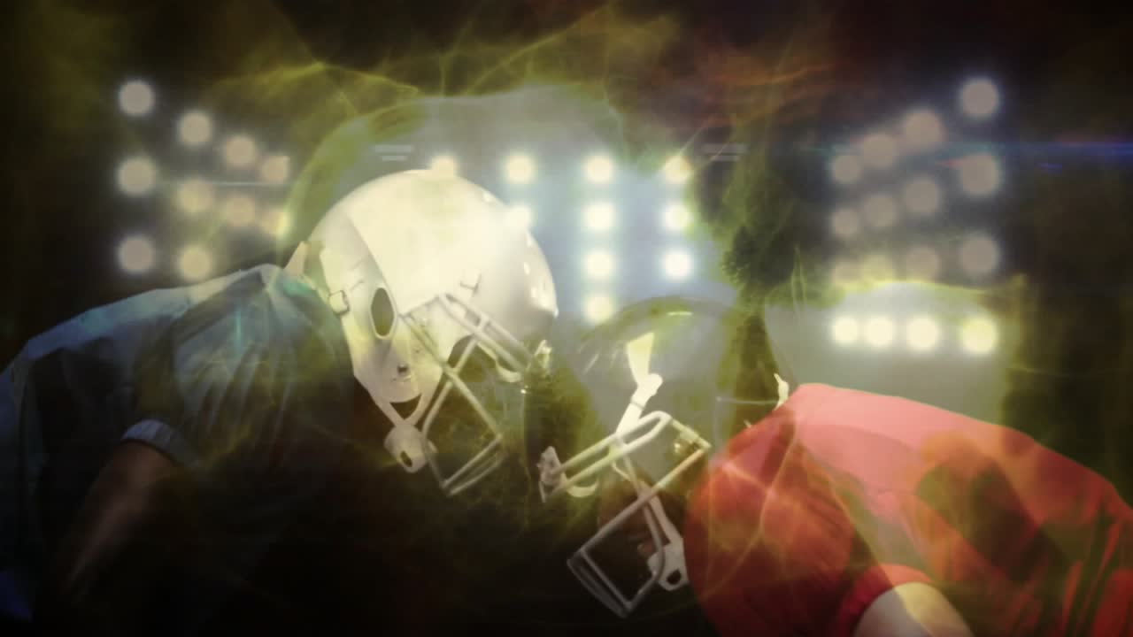 Floodlights intensifying driving energy around football players leaning heightening anticipation