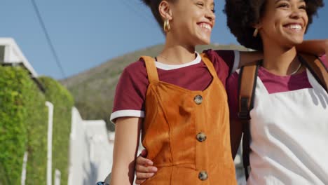 Two-mixed-race-women-walking-on-street