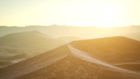 aerial view on big sand dunes in sahara desert at sunrise