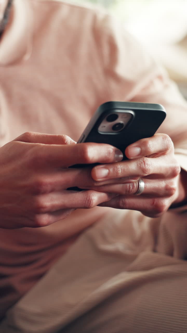 Close-up of Person's Hands Scrolling and Typing on a Smartphone