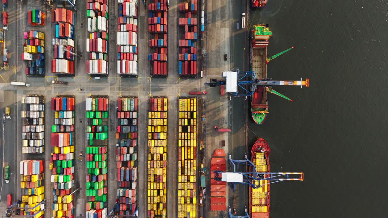 Colorful containers, cranes, vehicles, rhythm - fragility of global trade system