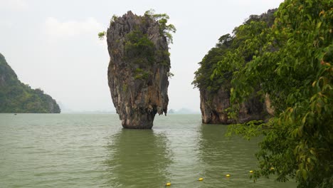 khao tapu limestone pinnacle at james bond island in phang nga bay, thailand.