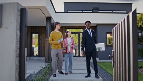 potential homebuyers viewing modern luxury house