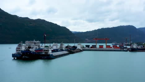 industrial factory real shot of shipbuilding and ship repair yard. shipyard contains many cranes, dry docks, slipways, warehouses, painting facilities and large areas for fabrication of ships