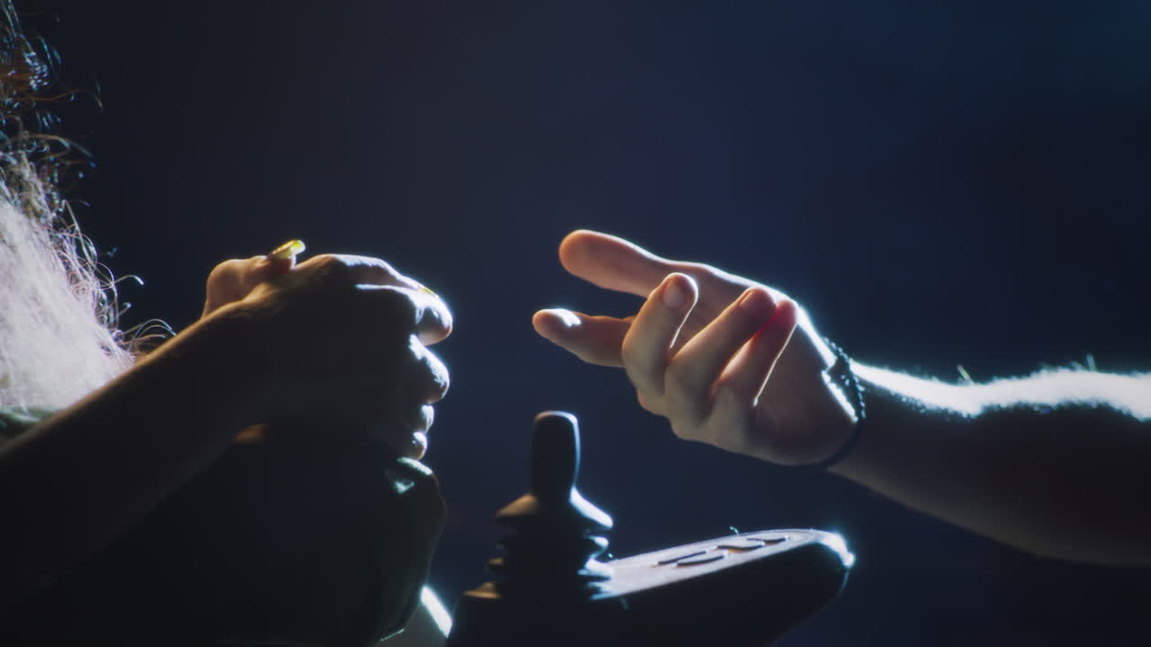 Person operating a Wheelchair with Support