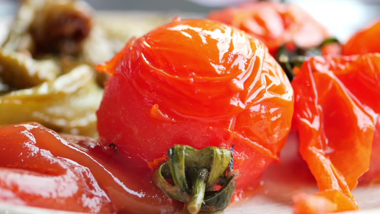 Baked tomato and capsicum on plate ,