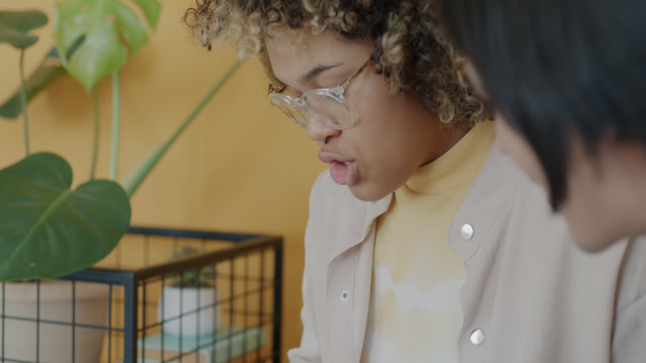 Woman Discussing and Reviewing Documents in a Meeting