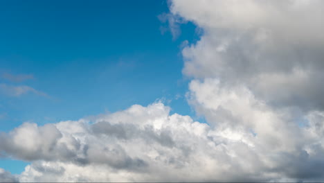 Timelapse-of-thick-white-clouds-that-become-animated-in-the-strong-wind