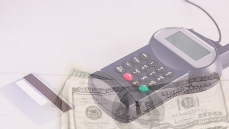 animation of dollar banknotes falling over payment terminal