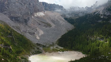 Aerial-video-of-Lake-Sorapis-in-Italy,-showcasing-its-natural-beauty-and-peaceful-surroundings