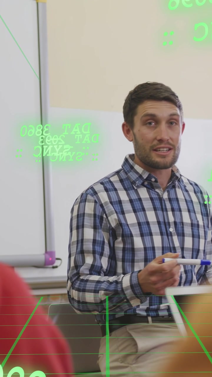 Vertical video: Teacher gesturing marker at whiteboard making green gridlines and teaching students