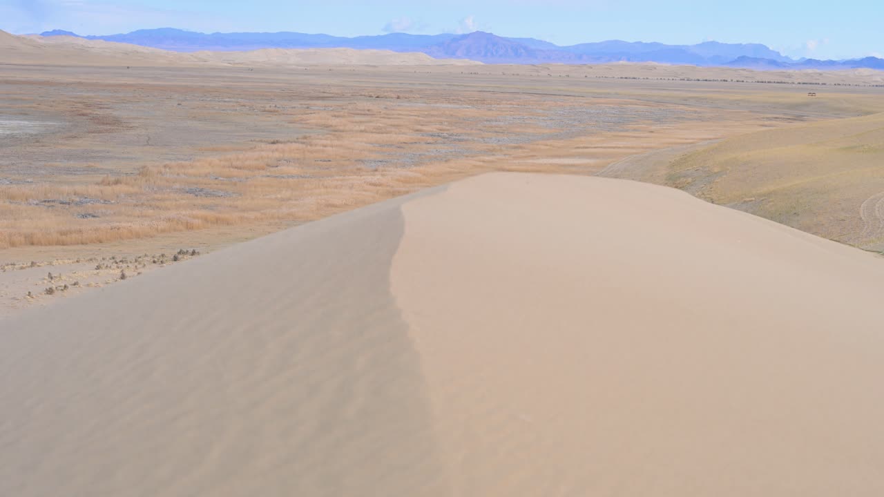 Sand Dunes and Mountain Landscape