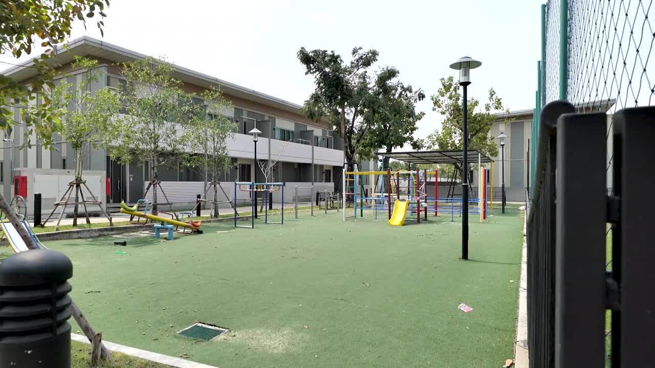 Colorful Children Playground In The Garden On Sunny Day