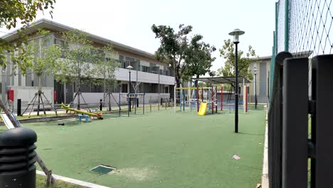 colorful children playground in the garden on sunny day