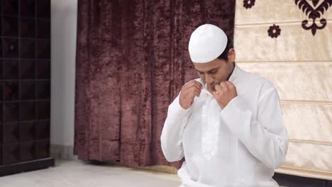 indian muslim man doing rituals of ramadan prayer