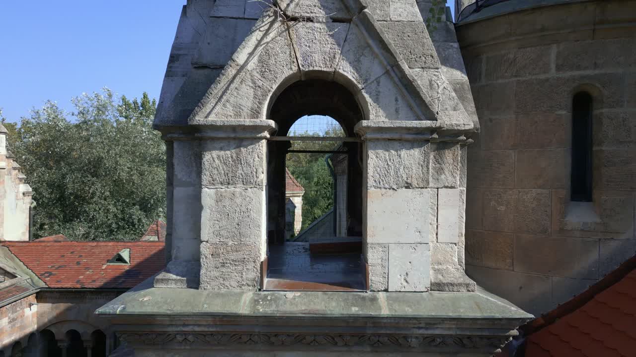 Rear view of Ják Chapel’s stone tower showcasing its arched opening and craftsmanship