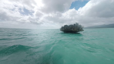 Landscape-with-Crystal-Rock-in-the-ocean-and-distant-mountains-of-Mauritius