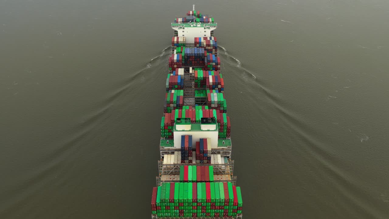 Cargo ships seen from above transporting goods along the Elbe in Germany