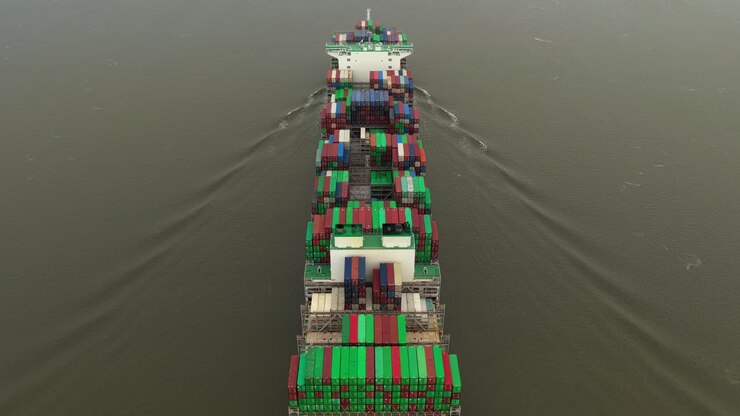 Cargo ships seen from above transporting goods along the Elbe in Germany