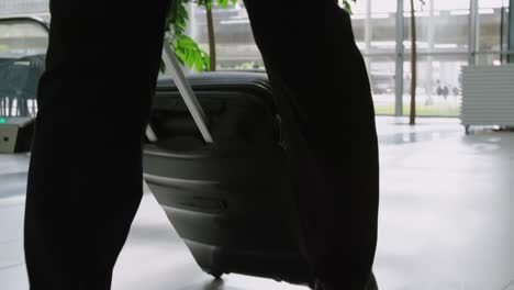 businessman carrying a suitcase in office 4k