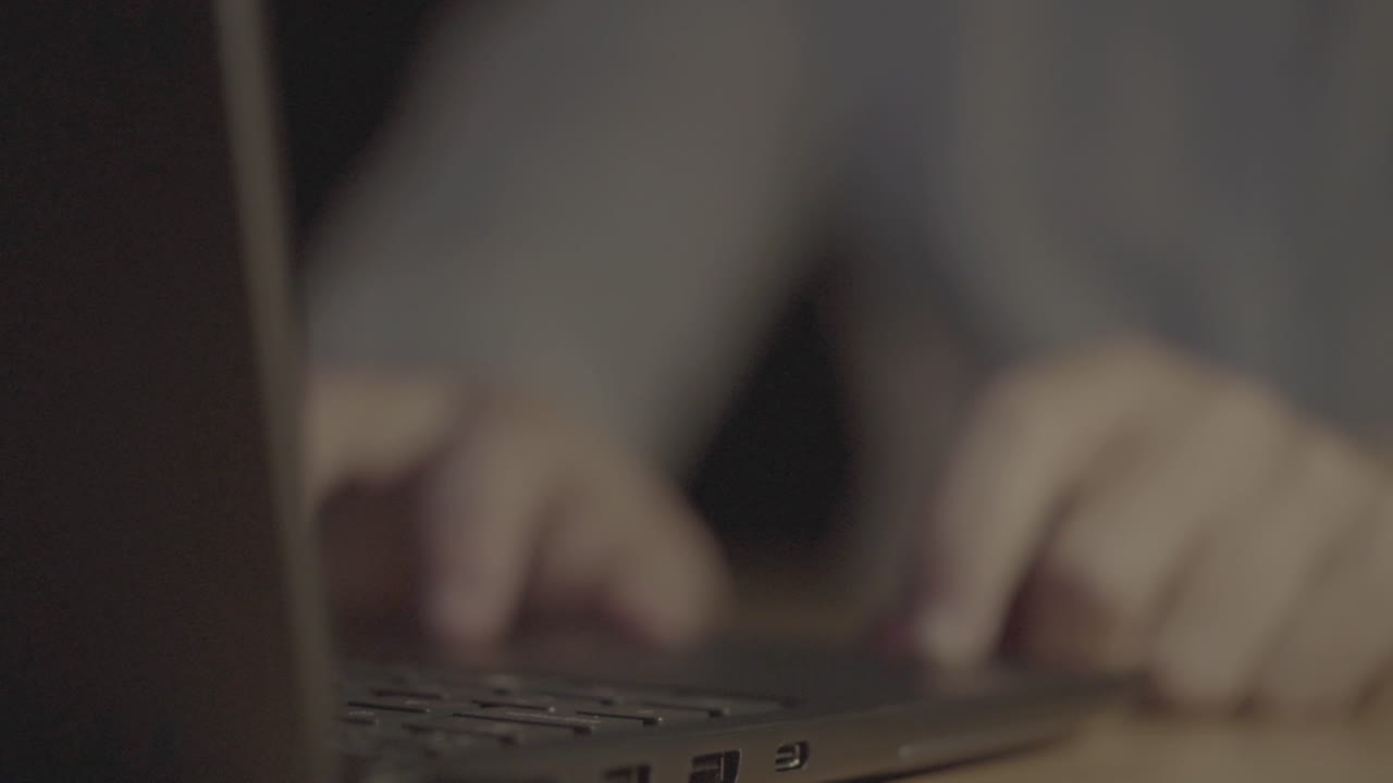 Person typing on a laptop