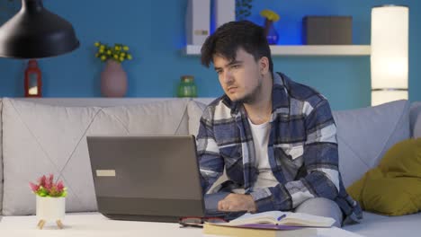 Man-watching-movie-on-laptop-at-night.