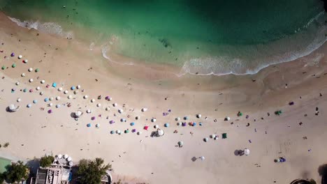 a static aerial view of a yacht at the shek o beach in hong kong as public beaches reopening, after months of closure amid coronavirus outbreak, to the public