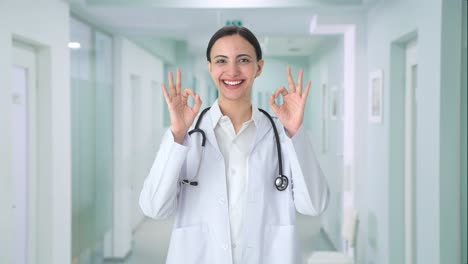 Happy-Indian-female-doctor-showing-okay-sign