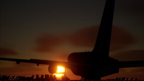 aterrizaje de avión al atardecer sobre la ciudad