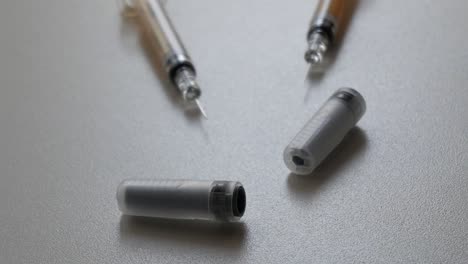 close up shot of syringes and containers