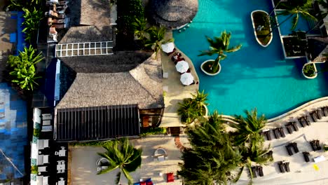 A-slow-flyover-a-resort-swimming-pool-located-in-Thongson-Bay,-a-cape-in-Koh-Samui-island-in-Surat-Thani-province-in-Southern-Thailand